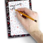 Right,Hand,Writing,On,Notebook,With,White,Background.,Top,View